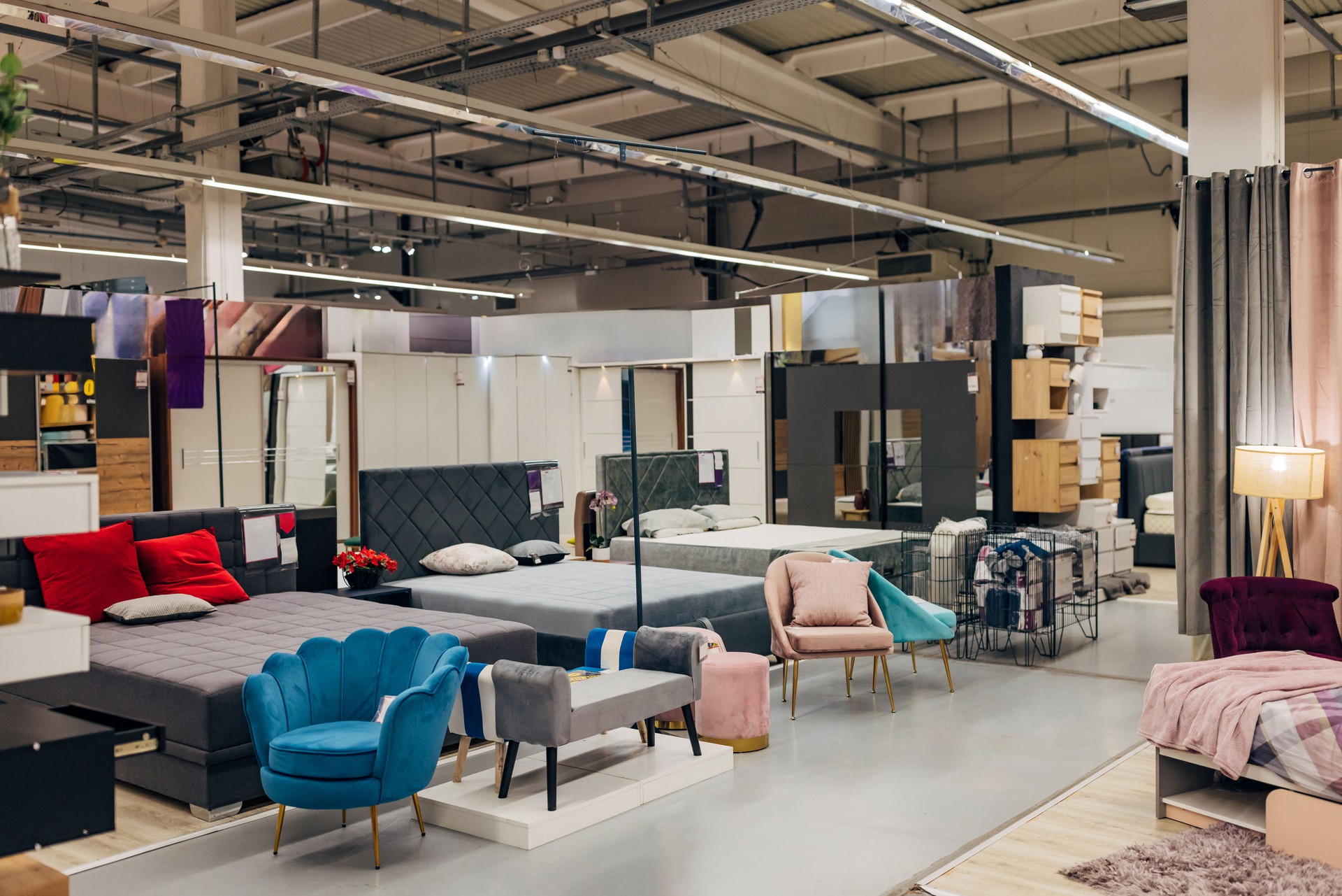 Different types of beds on display in a department store